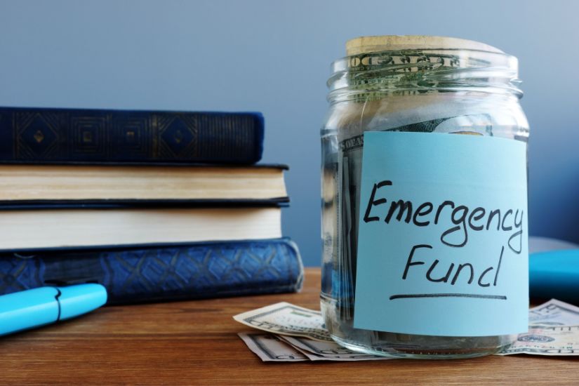 Emergency fund protection. Start with an emergency fund of 1,000 euros and aim for three to six months of living expenses. Once these are determined, you can use more money towards your exciting goals. A jar infront of books with emergency fund written on it.