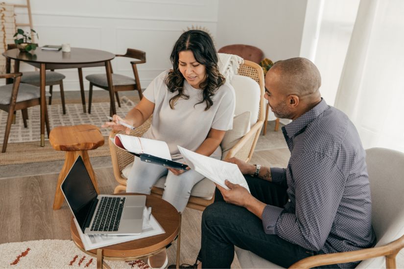 Budgeting doesn’t have to be boring! A couple looking at their financial statements.