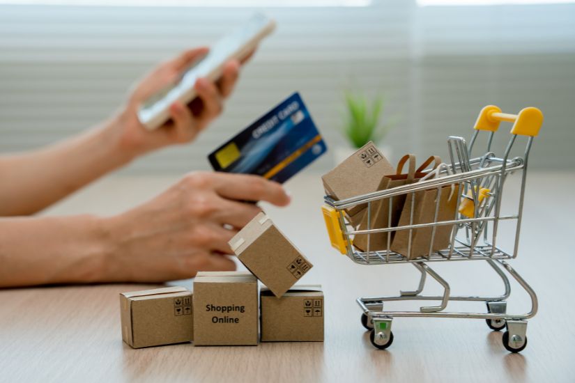 Set Spending Limits. A person using a phone to buy boxes.