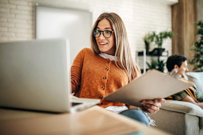 We want to build a successful online business as women in our 40s. A woman sitting infront of her computer.