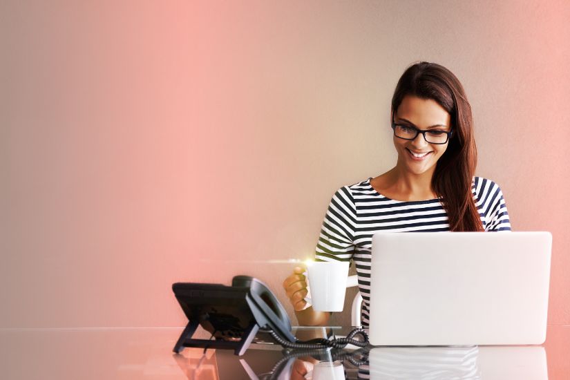 Having a dedicated workspace is crucial. A woman sitting infront of her laptop.