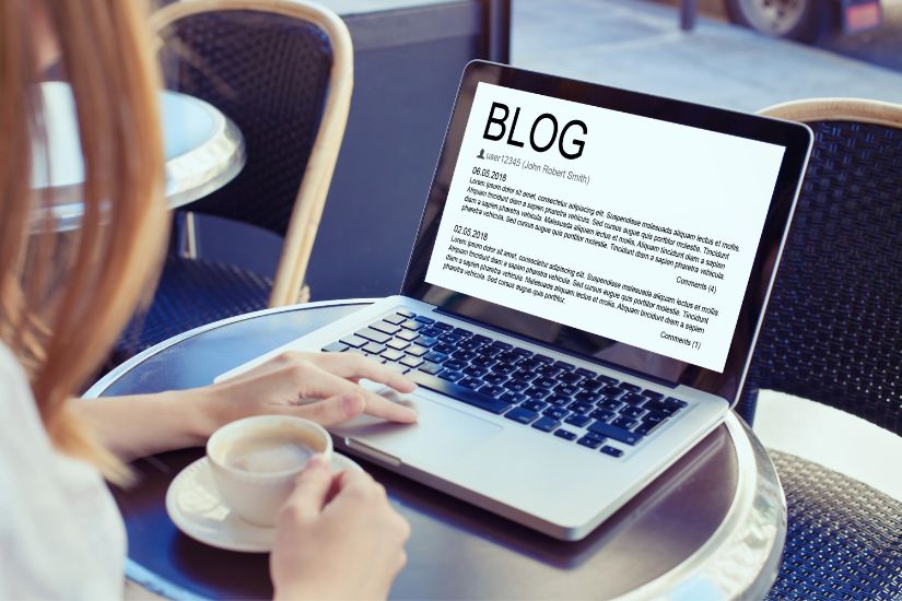 High-quality content is the backbone of a successful blog. Woman in front of a laptop writing